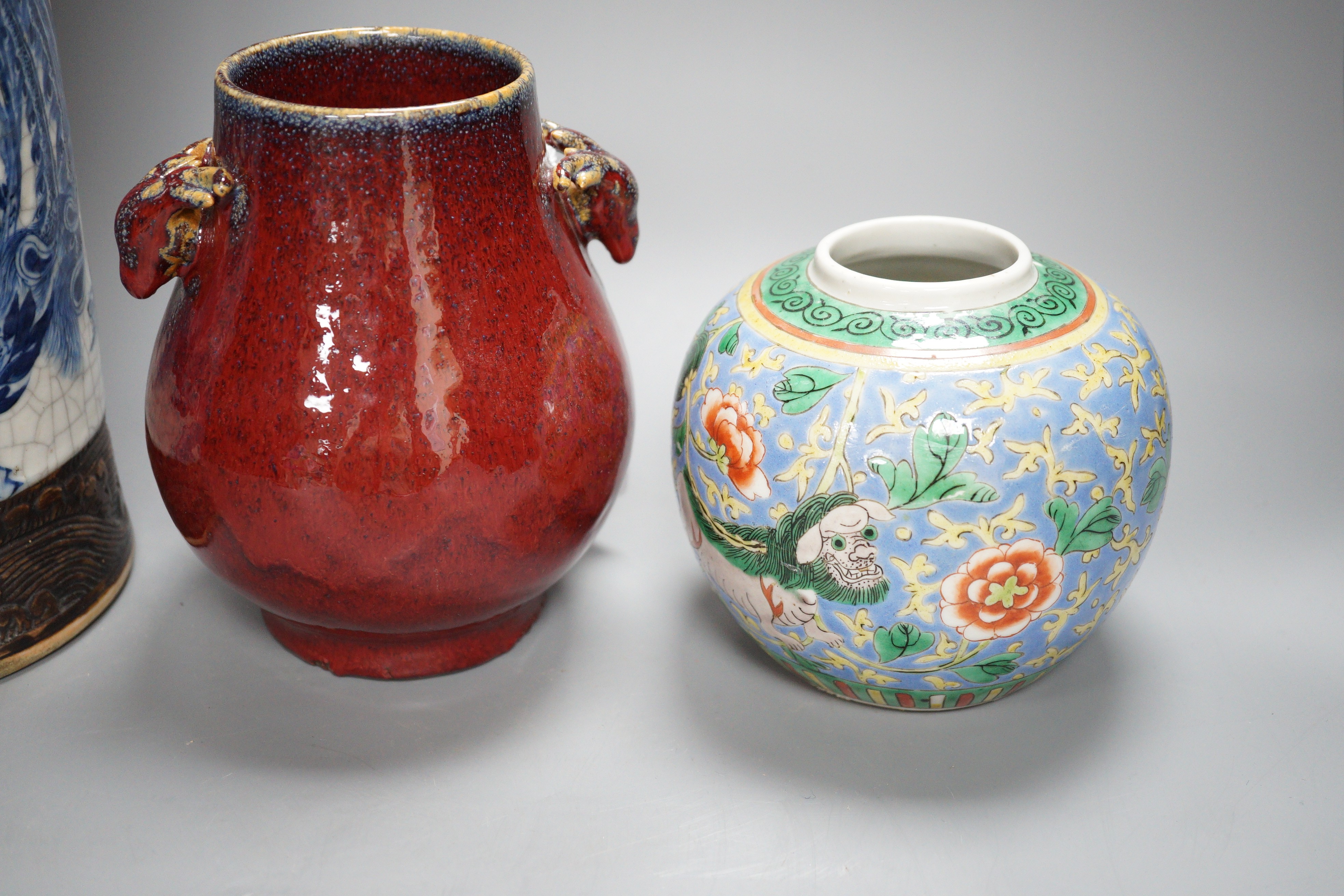 A large Chinese blue and white crackle glaze vase, a sang de boeuf vase and a monochrome jar, tallest 40cm